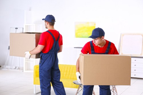 Professional movers handling furniture